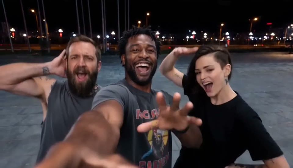 The group finale of a Gangnam Style AI sample video with all three people shouting the hook close to the selfie camera